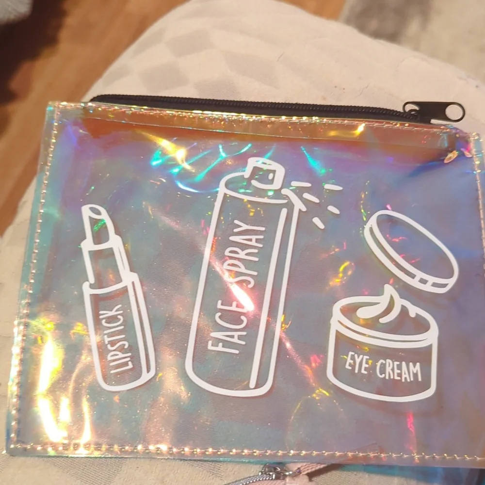 Cosmetic Bag Cases. Two. One Is Pink And White. One Is Shiny Pink.